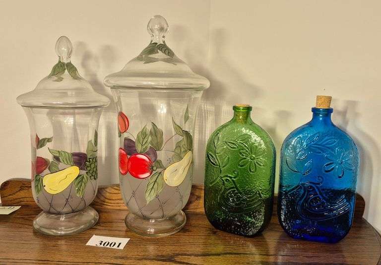 Two hand painted canisters, two Italy bottles, yellow sun corked bottle