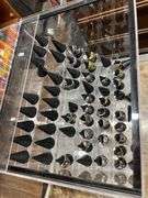 SMALL PLASTIC DISPLAY CASE WITH ASSORT. SIZE MENS RINGS