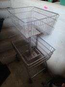 Rolling Metal Wire Basket Stand in Barn