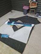 Cosco Chair, Snow Shovel and Rugs on Front Porch