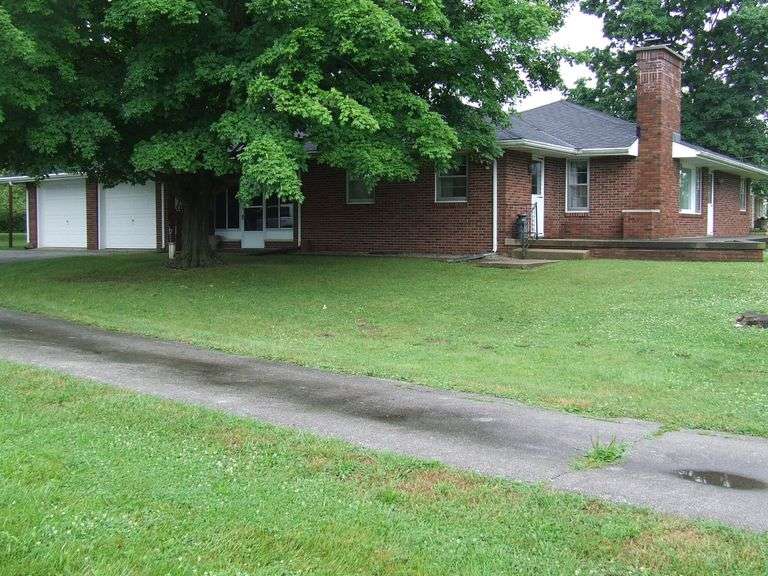 Two Properties Offered: 1,444sqft Country Home on Full Basement and a 100 x 132 City Lot with Garage
