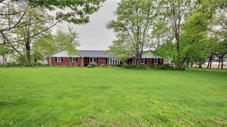Peaceful Country Living in this 5 Bedroom Ranch on 1 Acre with four season room and Heated Garage