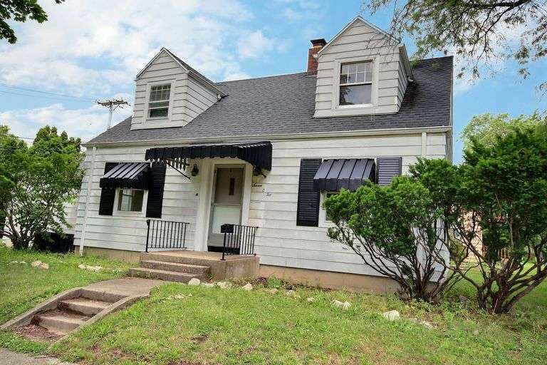 Charming 2 Bed Home in Woodhurst Neighborhood on Full Basement with 2 Car Garage and Loads of Possibility