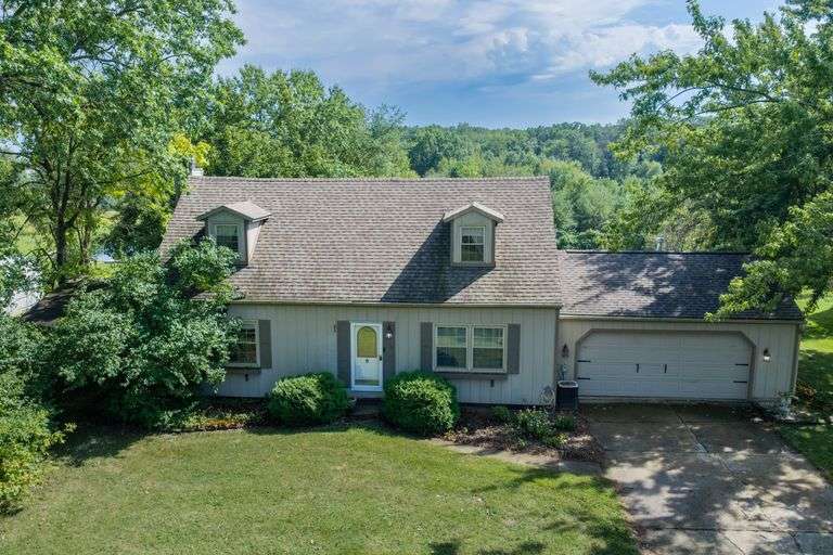 4 Bed Cape Cod with 36x40 Pole Building on 5.19 Acres on Full Walk-Out Basement in NWAC School District