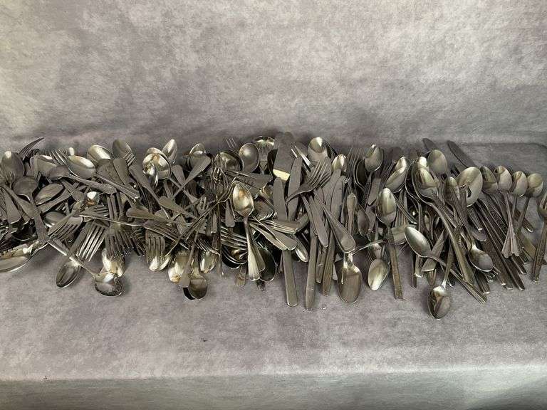 Large assortment of stainless and silver plated silverware
