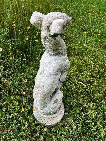 Cement sitting greyhound dog statue