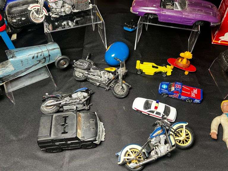 Tabletop of model cars, various toys
