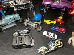 Tabletop of model cars, various toys