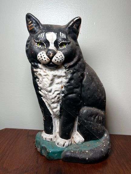 Cast metal cat door stop