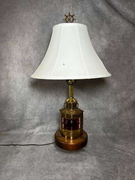 Nautical themed table lamp with red globe