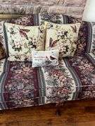 Upholstered floral print sofa