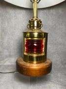 Nautical themed table lamp with red globe