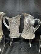 4 clear glass pitchers
