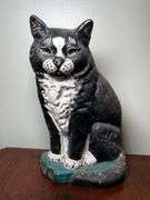 Cast metal cat door stop