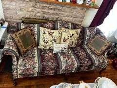 Upholstered floral print sofa