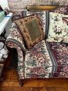 Upholstered floral print sofa