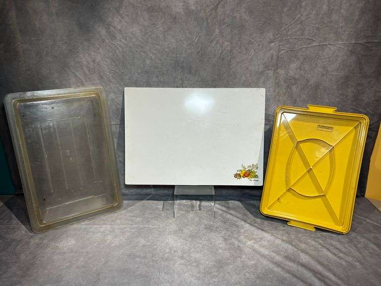 Glass Corningware cutting board, Tupperware container and plastic Cambro container