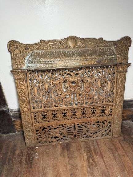 Salvaged Victorian cast metal fireplace surround