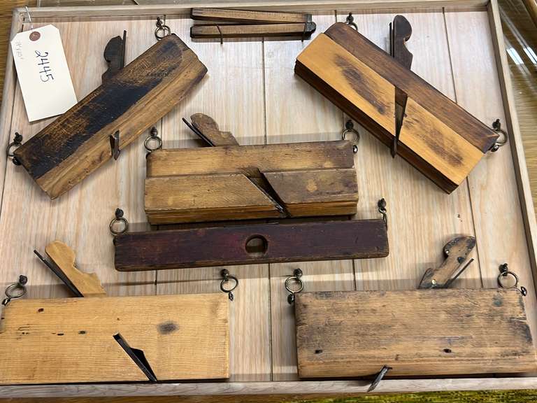 Mounted display of antique wood molding and shaping hand planes