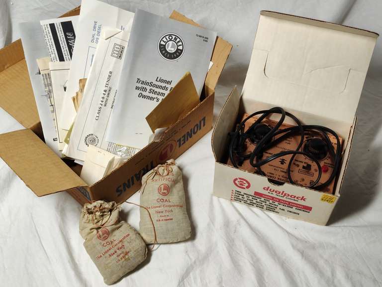 Dual pack train control untested and a box of Lionel paperwork two bags of Lionel Coal