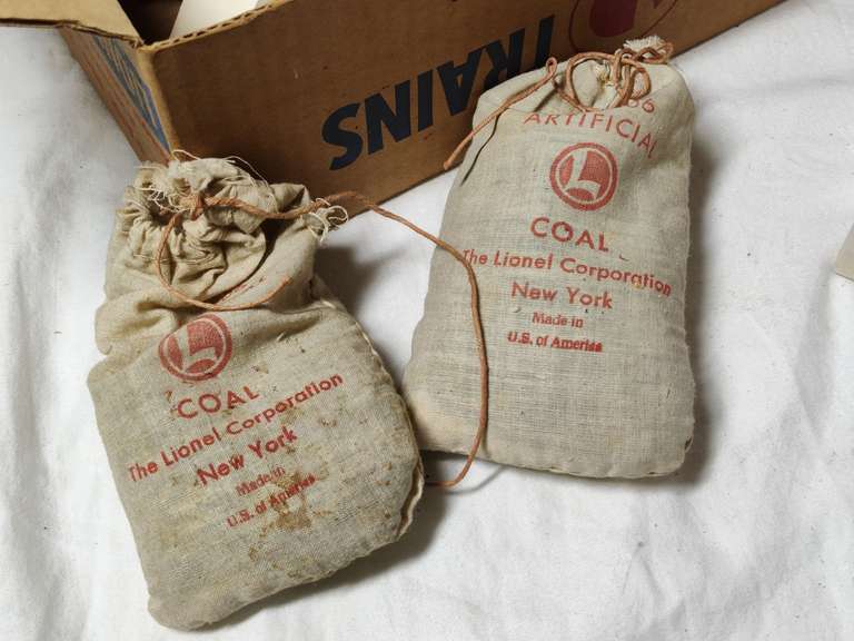 Dual pack train control untested and a box of Lionel paperwork two bags of Lionel Coal