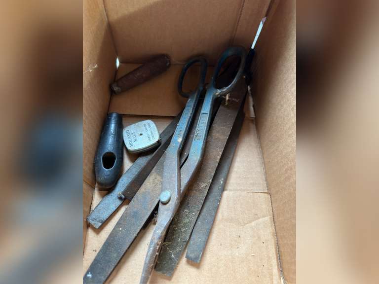 Box with metal cutters and files