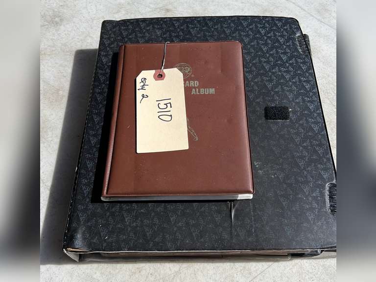Photo albums of collectible sports cards.