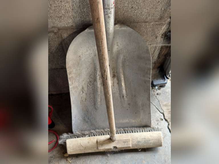 Aluminum scoop shovel and a pushbroom