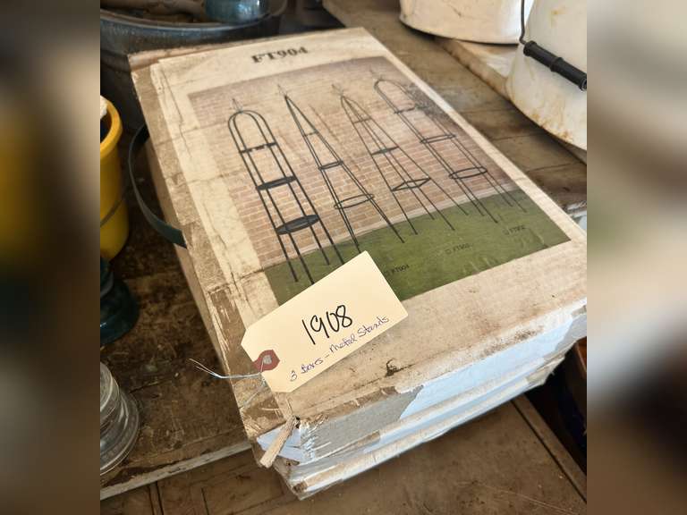 Three boxes with metal plant stands