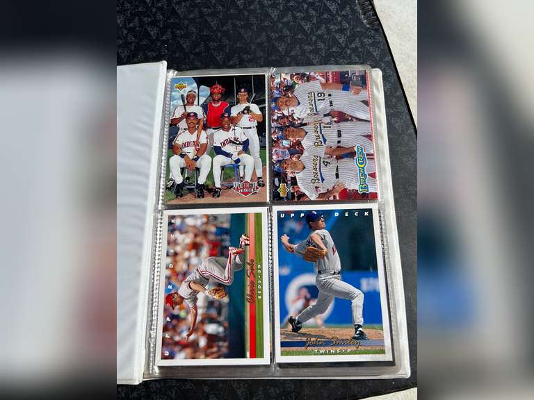 Photo albums of collectible sports cards.