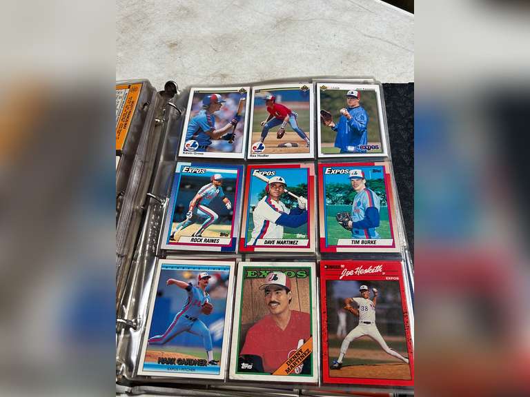 Photo albums of collectible sports cards.
