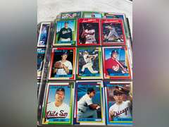 Photo albums of collectible sports cards.