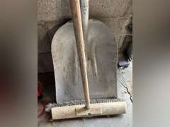 Aluminum scoop shovel and a pushbroom