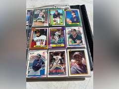 Photo albums of collectible sports cards.