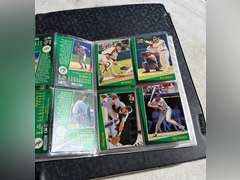 Photo albums of collectible sports cards.