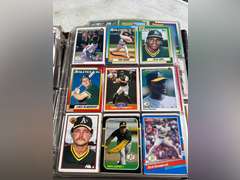 Photo albums of collectible sports cards.