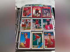 Photo albums of collectible sports cards.