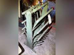 Vintage magazine stand, missing one of the decorative top pieces shown in photos. It is 30 inches tall by 12 inches wide by 12 1/2 inches deep.