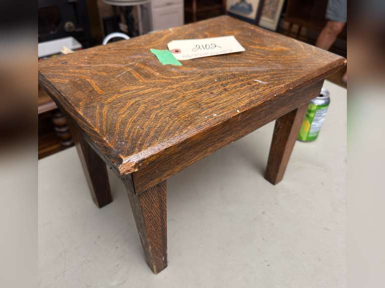 Tucker Oakwood stool, 10 1/2 half inches tall by 15 inches wide by 10 1/2 inches deep