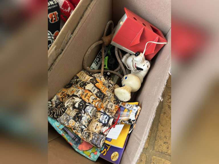 Two boxes with stuffed animals and kids toys