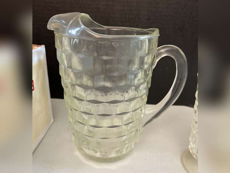 Very heavy glass pitcher with 12 matching stemmed glasses.