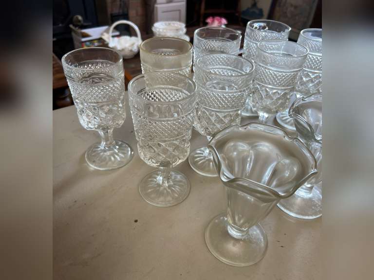 8 Heavy stemmed drinking glasses and 3 sundae glasses.