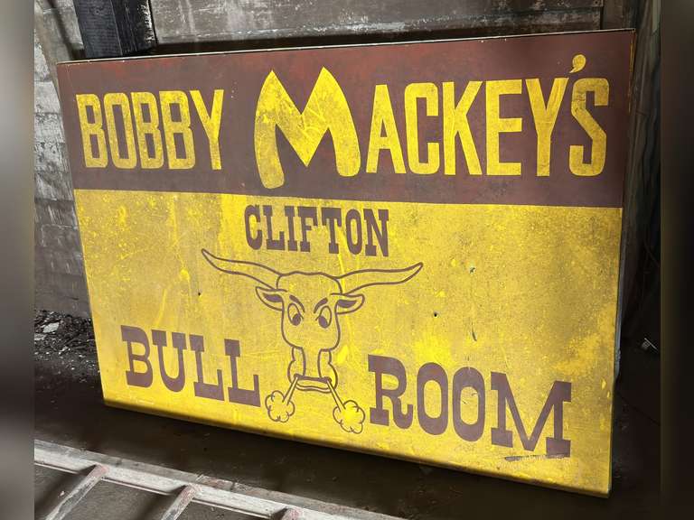 Bobby Mackey's Clifton bull room sign- Condition Unknown other than what you can see. This item is extremely heavy. The buyer is fully responsible for bringing their own manpower and equipment to load; we will not have staff to help.