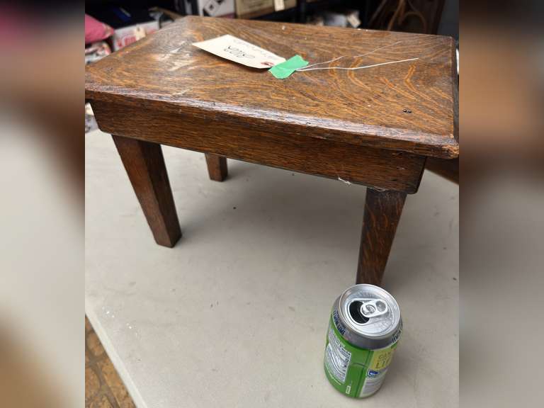 Tucker Oakwood stool, 10 1/2 half inches tall by 15 inches wide by 10 1/2 inches deep
