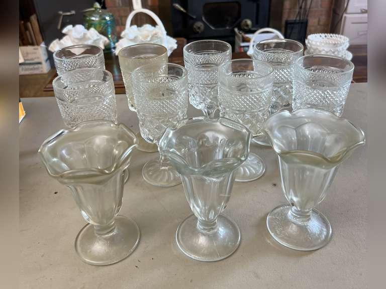 8 Heavy stemmed drinking glasses and 3 sundae glasses.