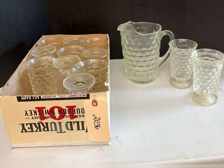 Very heavy glass pitcher with 12 matching stemmed glasses.