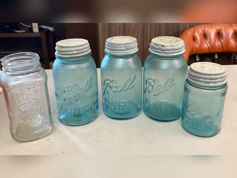 Blue Ball jars with metal caps and 1 clear Mason jar, no lid.