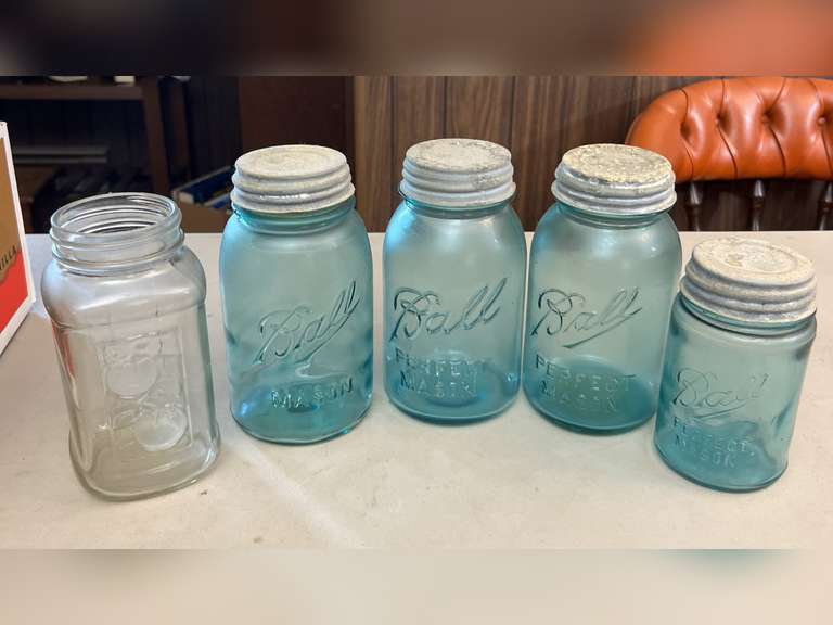 Blue Ball jars with metal caps and 1 clear Mason jar, no lid.