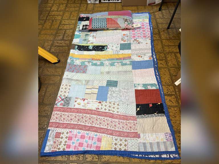Vintage quilt with feather pillow. Quilt is 82” x 76”.