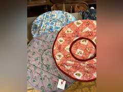 Fabric bags, plate storage covers and holiday vests.